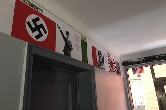The building lobby's fascist imagery.